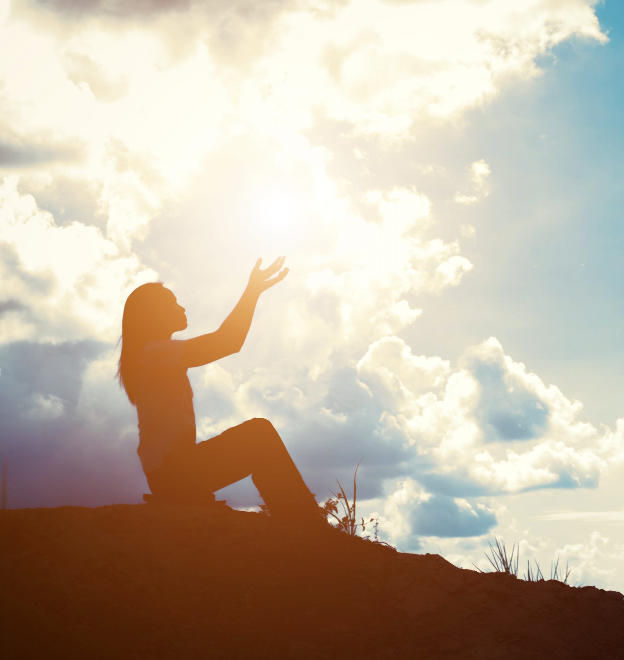 silhouette woman with raised hands min masolata 1